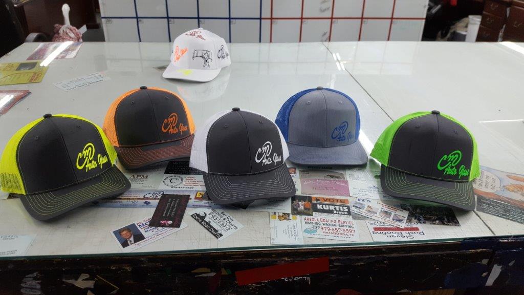 Custom printed caps with different colors — Bay City, TX — CM Auto Glass Inc. & Sign Works