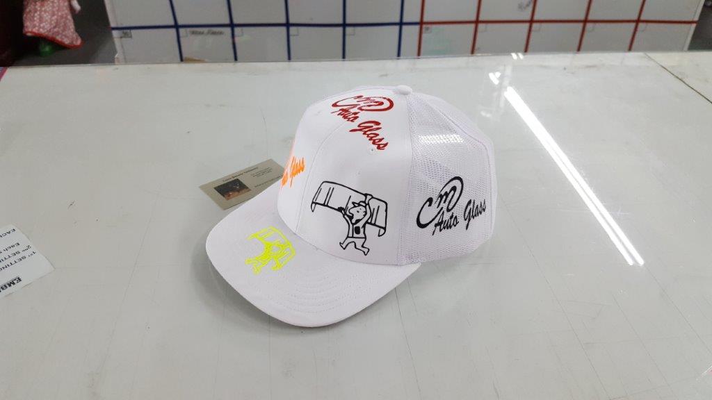 White color printed cap — Bay City, TX — CM Auto Glass Inc. & Sign Works