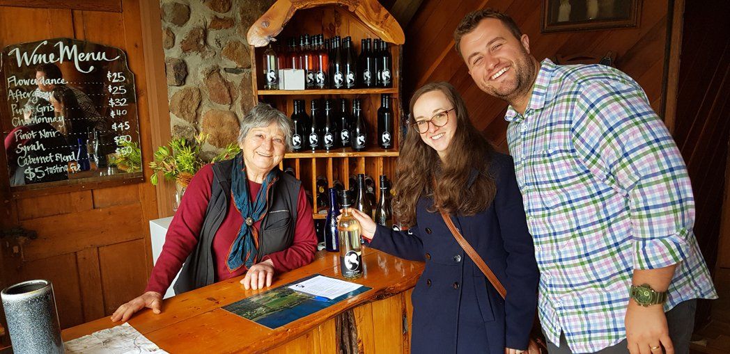 old woman and couple in wine reception area