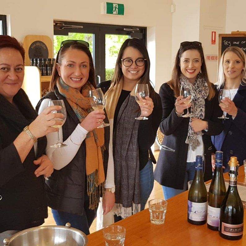 5 woman holding wines