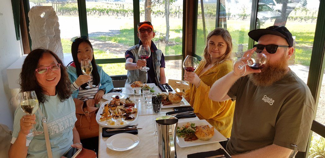 family eating indoor with wine
