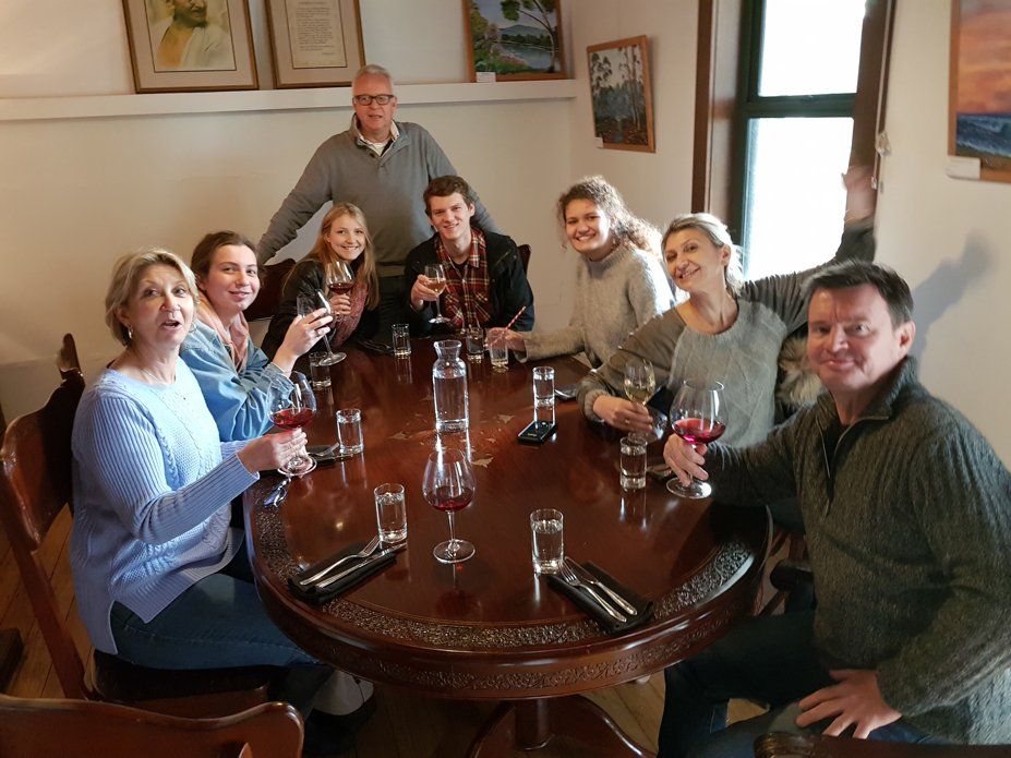 group of man and woman drinking wine