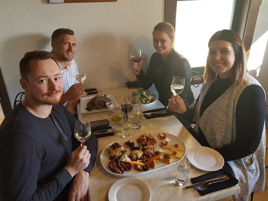 2 couples drinking wine