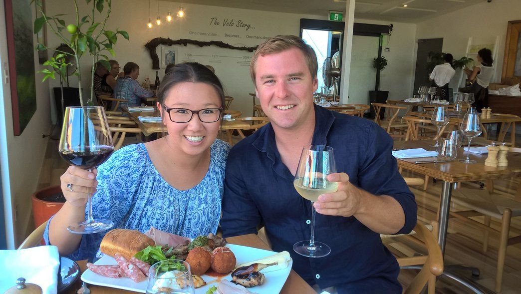 husband and wife drinking wine