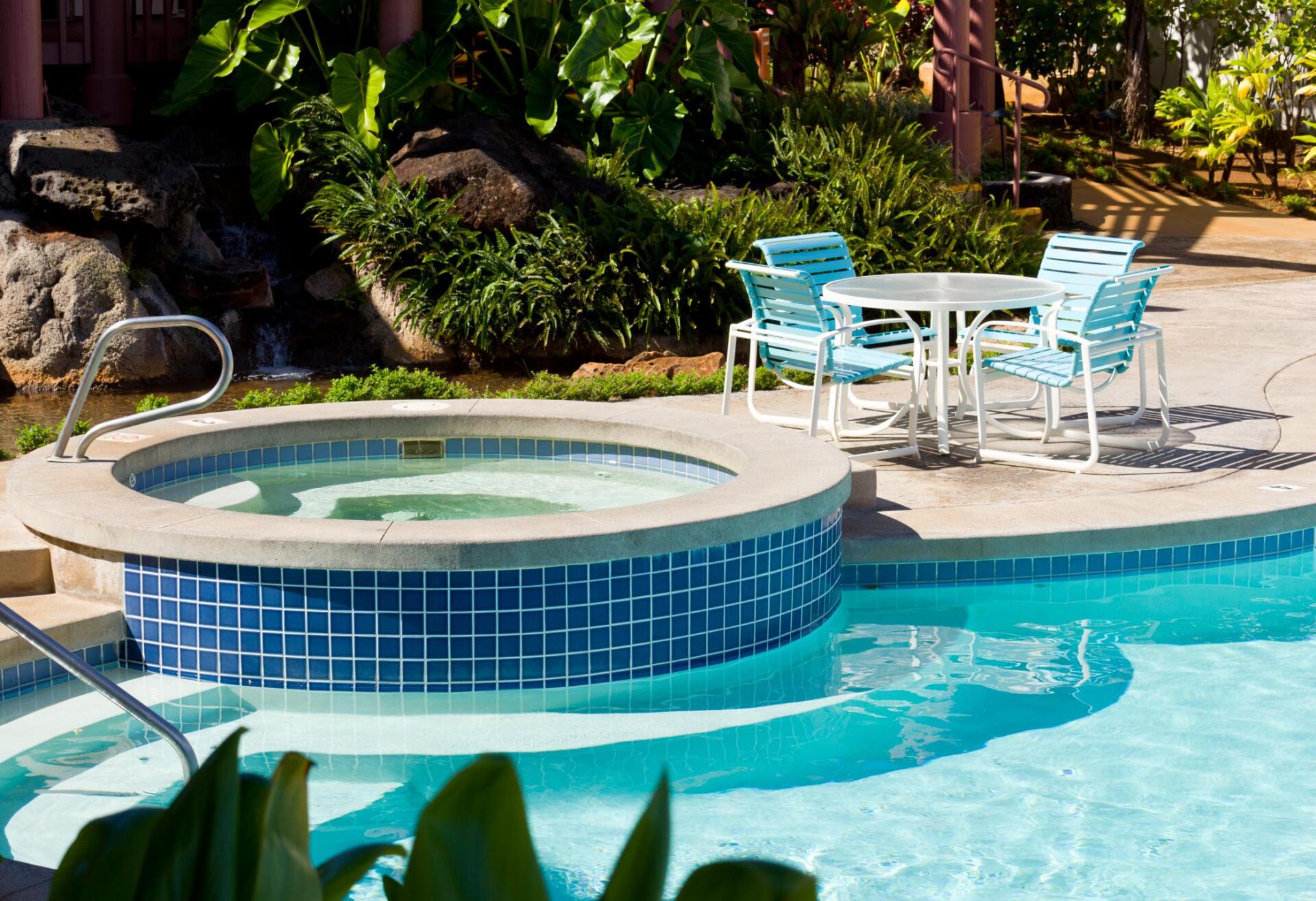 swimming pool with small jacuzzi