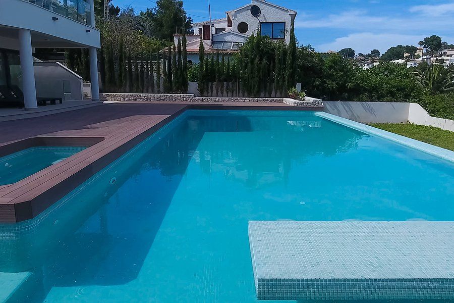 large pool with small jacuzzi and nice view