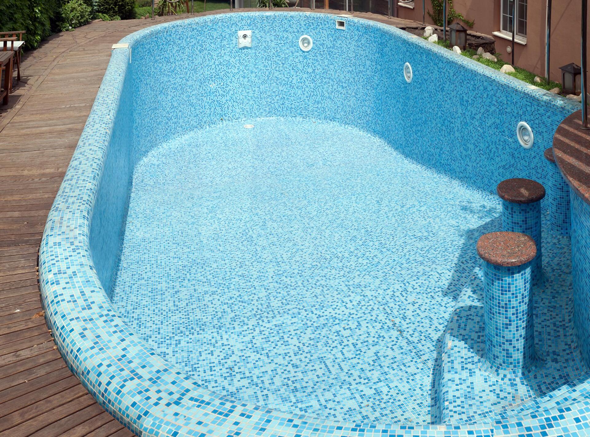 large and deep empty swimming pool