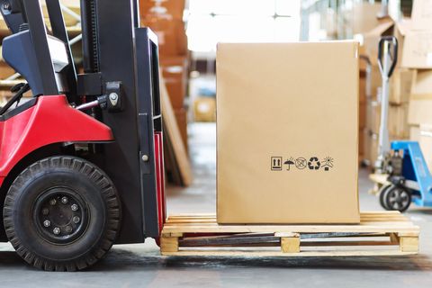 Heavy Duty Moving — Movers Carrying Sofa in Brownsburg, IN Heavy Duty Moving — Movers Carrying Sofa in Brownsburg, IN