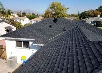 Roofing Maintenance — House roof with chimney in San Dimas, CA Roofing Maintenance — House roof with chimney in San Dimas, CA
