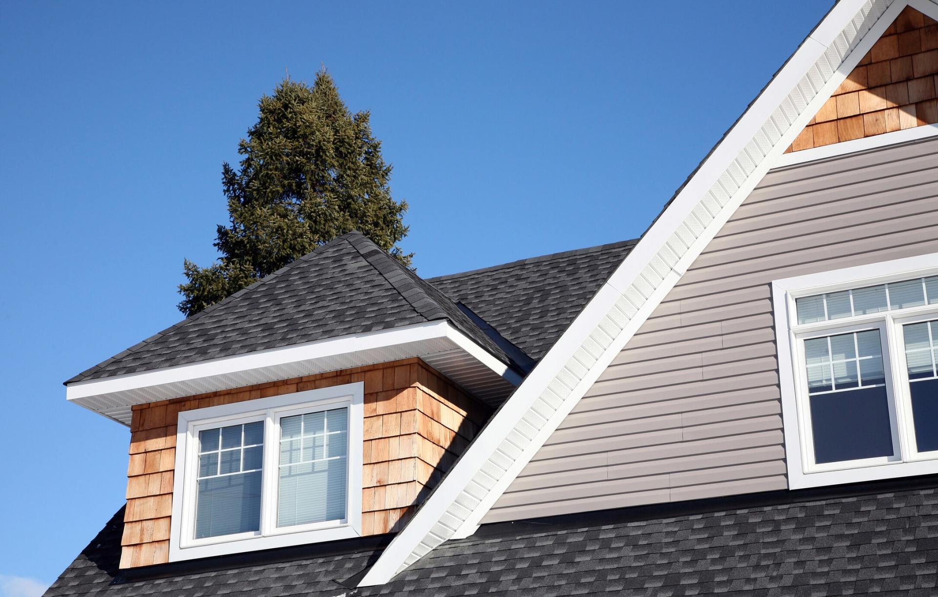 Roof Repairs — Man on house roof in San Dimas, CA