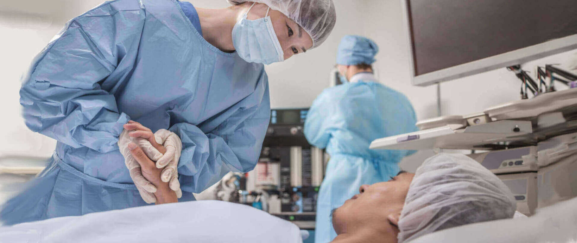surgeon comforts a patient