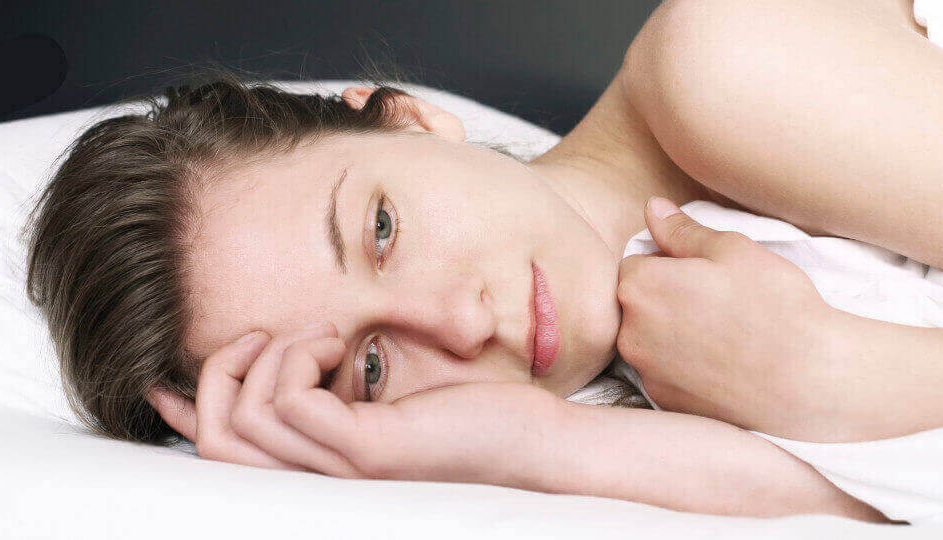 woman awake in bed