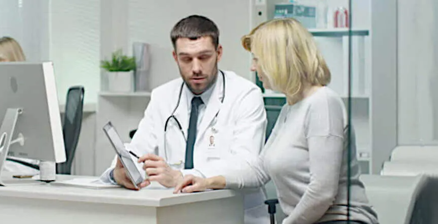 doctor explaining to a carpal tunnel patient