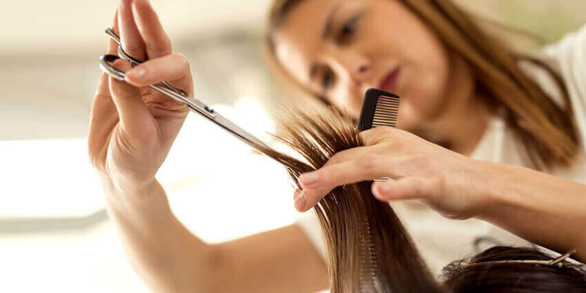 hair stylist cutting hair