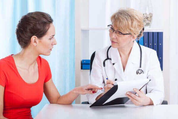 Female doctor talking to a female patient.