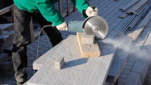 man using a vibrating power saw