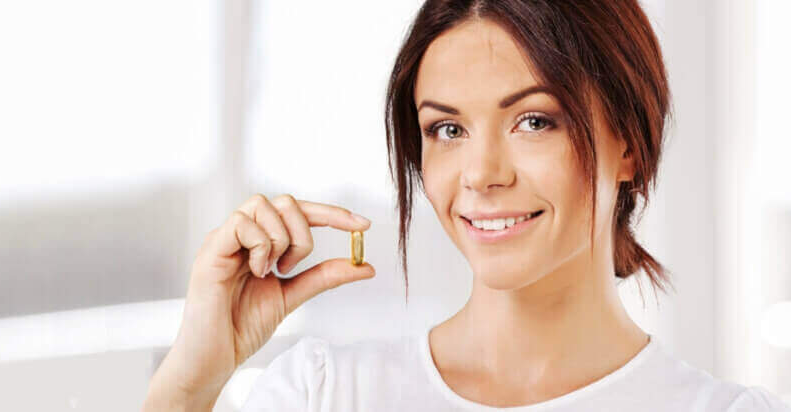 woman taking vitamin B6 for carpal tunnel