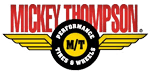 Mickey Thompson logo with red text over a yellow winged emblem and black circle with