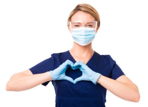 dentist doing a heath shape with hands, make your dental hygienist your best friend blog