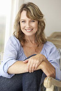 smiling woman, perfect bite with dentures
