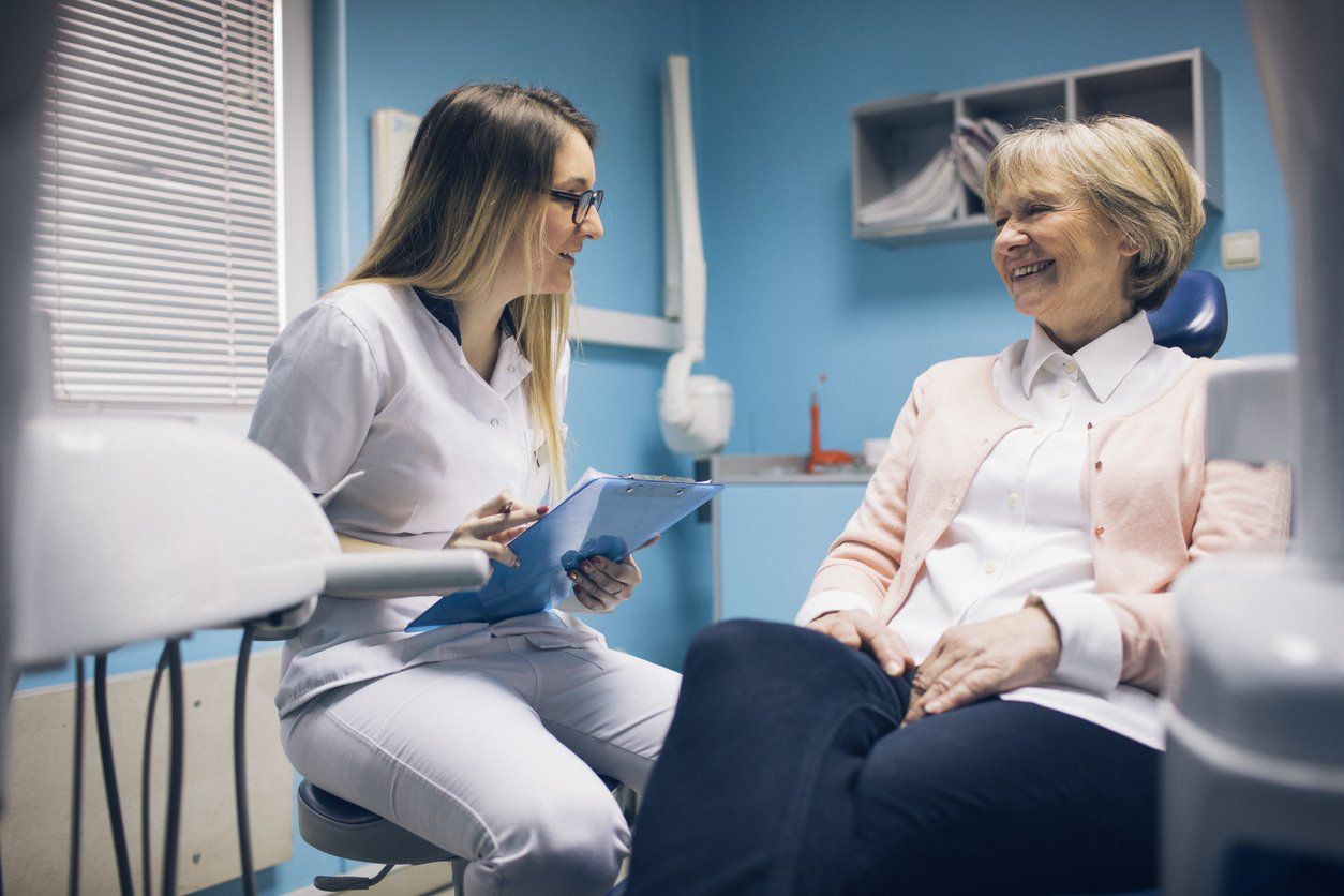 dental checkup with older woman