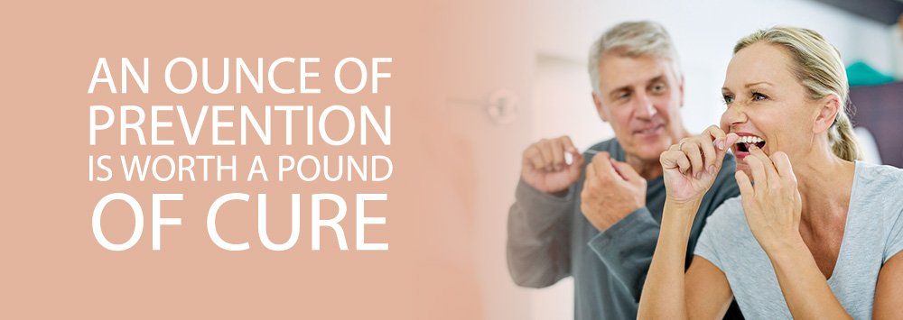 Older couple flossing, an ounce of prevention is worth a pound of cure blog