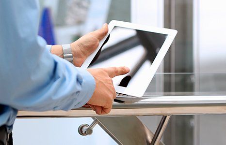 Person touching tablet screen
