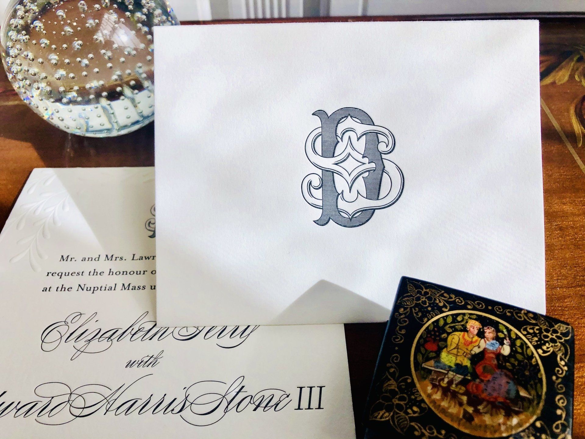 a custom monogram letterpressed wedding stationery with the initials d+s intertwined