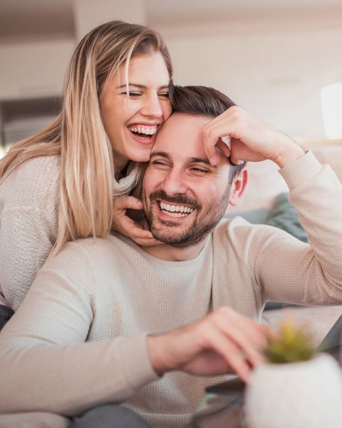 couple smiling on couch