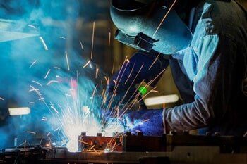 Worker Using The Welding Machine — Agricultural Supplies in Hanford, CA