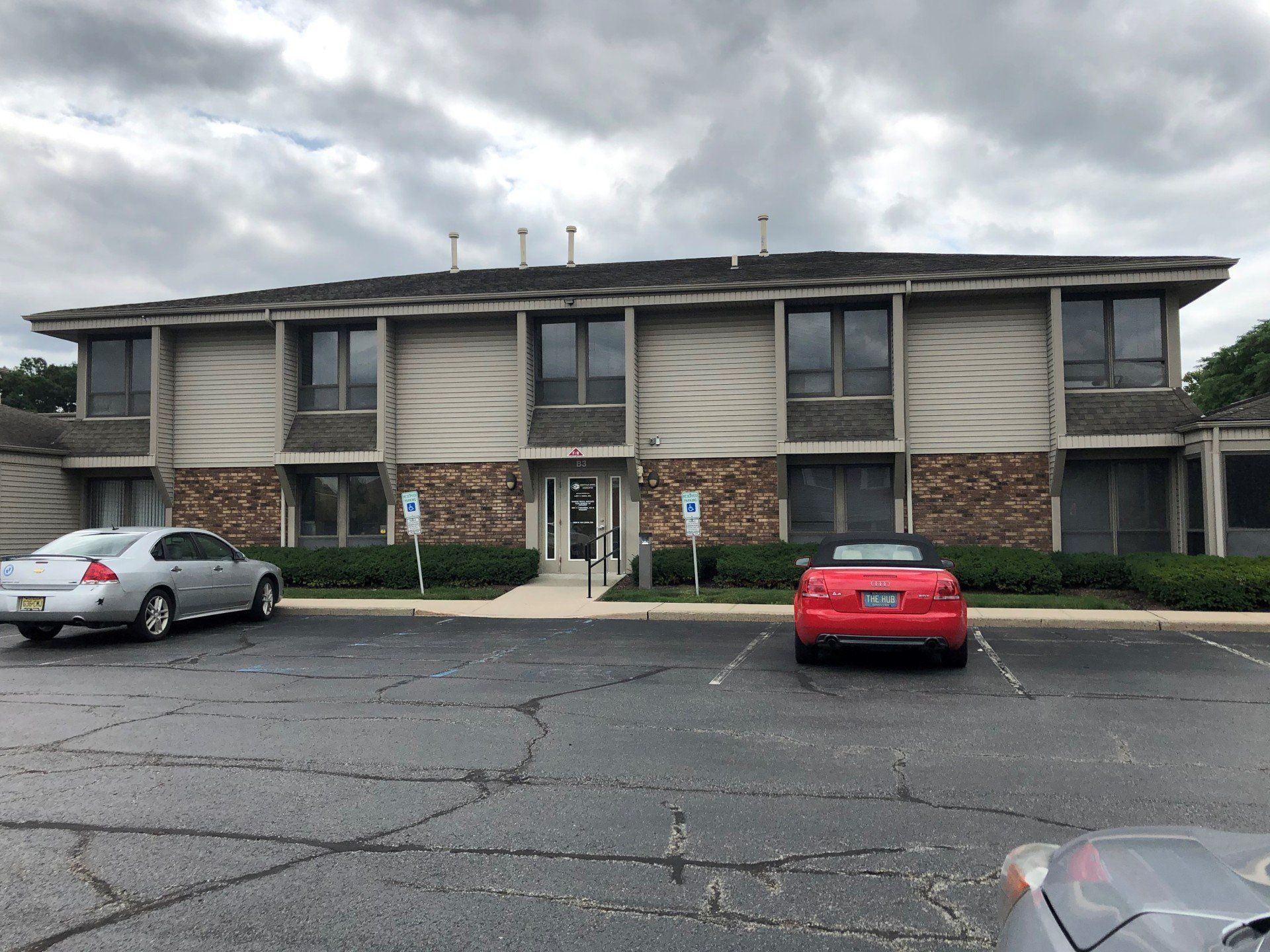 Two Cars On Parking Area — Clifton, NJ — Evergreen Commercial Real Estate Brokers Inc