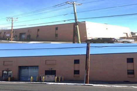 Wooden Post Infront Of Warehouse — Clifton, NJ — Evergreen Commercial Real Estate Brokers Inc