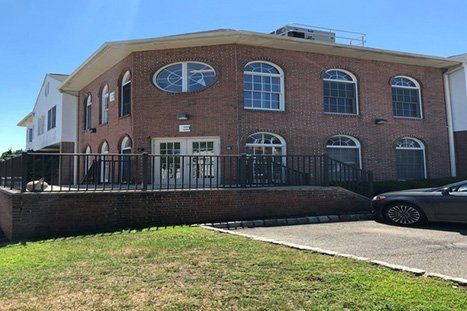 Brick Building With Stairs — Clifton, NJ — Evergreen Commercial Real Estate Brokers Inc