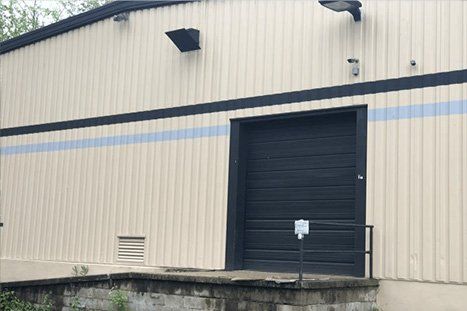 Black Warehouse Door — Clifton, NJ — Evergreen Commercial Real Estate Brokers Inc