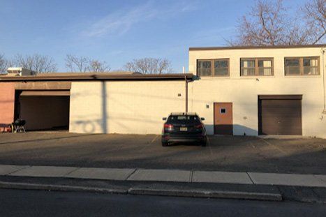 Car Infront Of Warehouse — Clifton, NJ — Evergreen Commercial Real Estate Brokers Inc