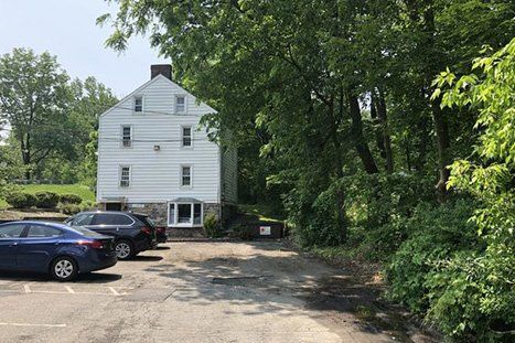 Parking Space For White Building — Clifton, NJ — Evergreen Commercial Real Estate Brokers Inc