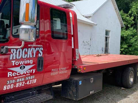 Red Towing Truck — Waynesburg, OH — Rocky’s Auto & Truck Parts Red Towing Truck — Waynesburg, OH — Rocky’s Auto & Truck Parts