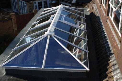 An aerial view of a roof with a glass roof
