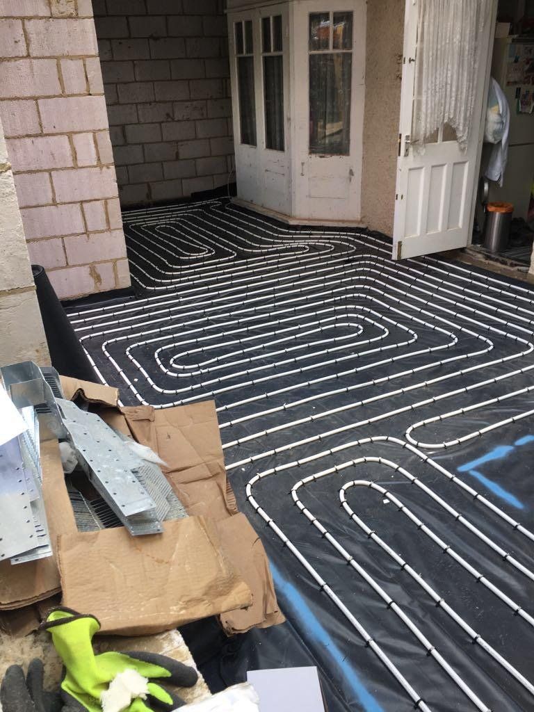 A black and white floor with tubes going through it