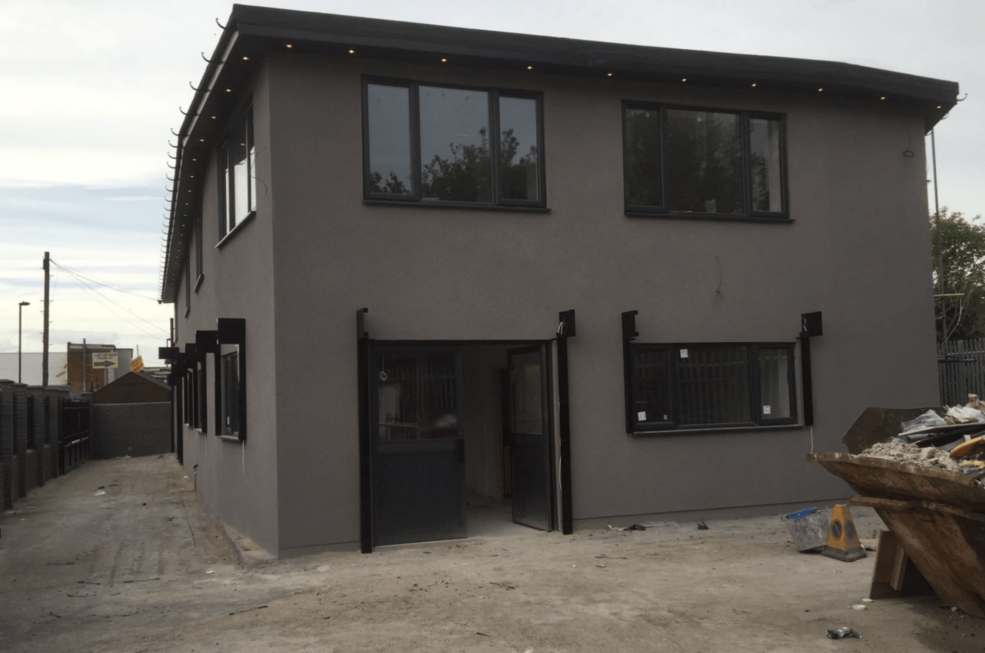 A large house with a lot of windows is being built