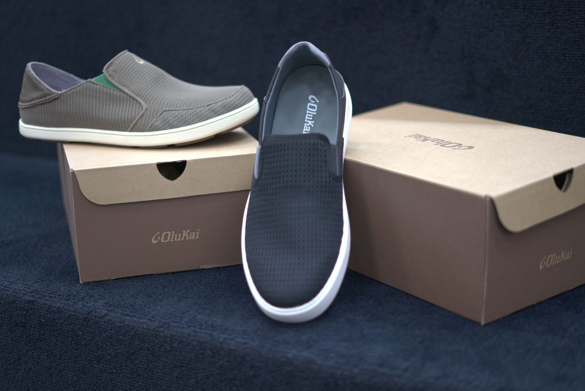 A pair of shoes sitting on top of a cardboard box