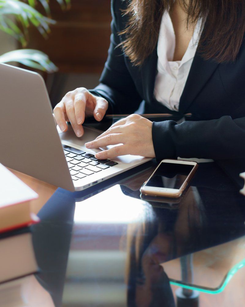 Attorney Using Laptop — Cumberland, MD — Buckel Levasseur Phillai & Beeman LLC Attorney Using Laptop — Cumberland, MD — Buckel Levasseur Phillai & Beeman LLC