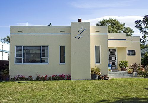 A white house with a blue stripe on the side