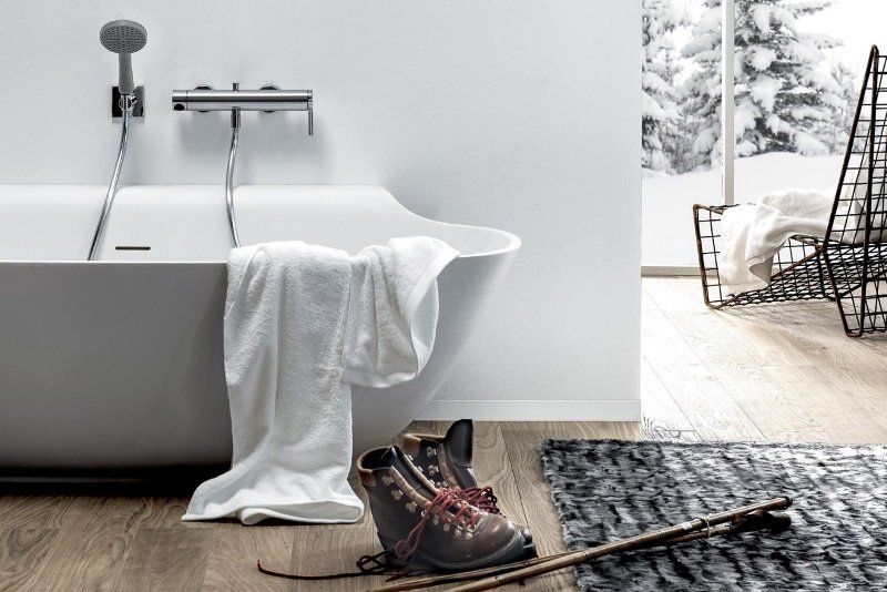 Bathroom decor can include rugs, chairs and even fireplaces Chairs, rugs and other non-traditional bathroom decor