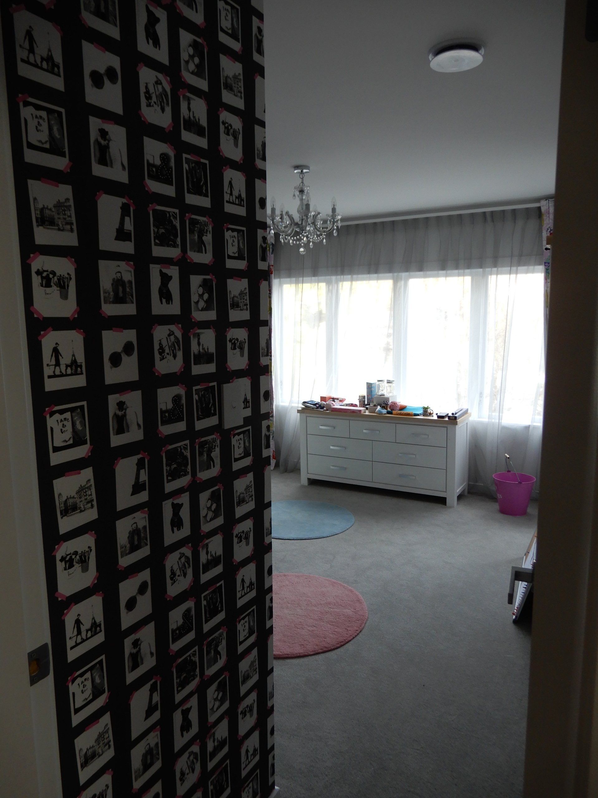 A room with a lot of pictures on the wall