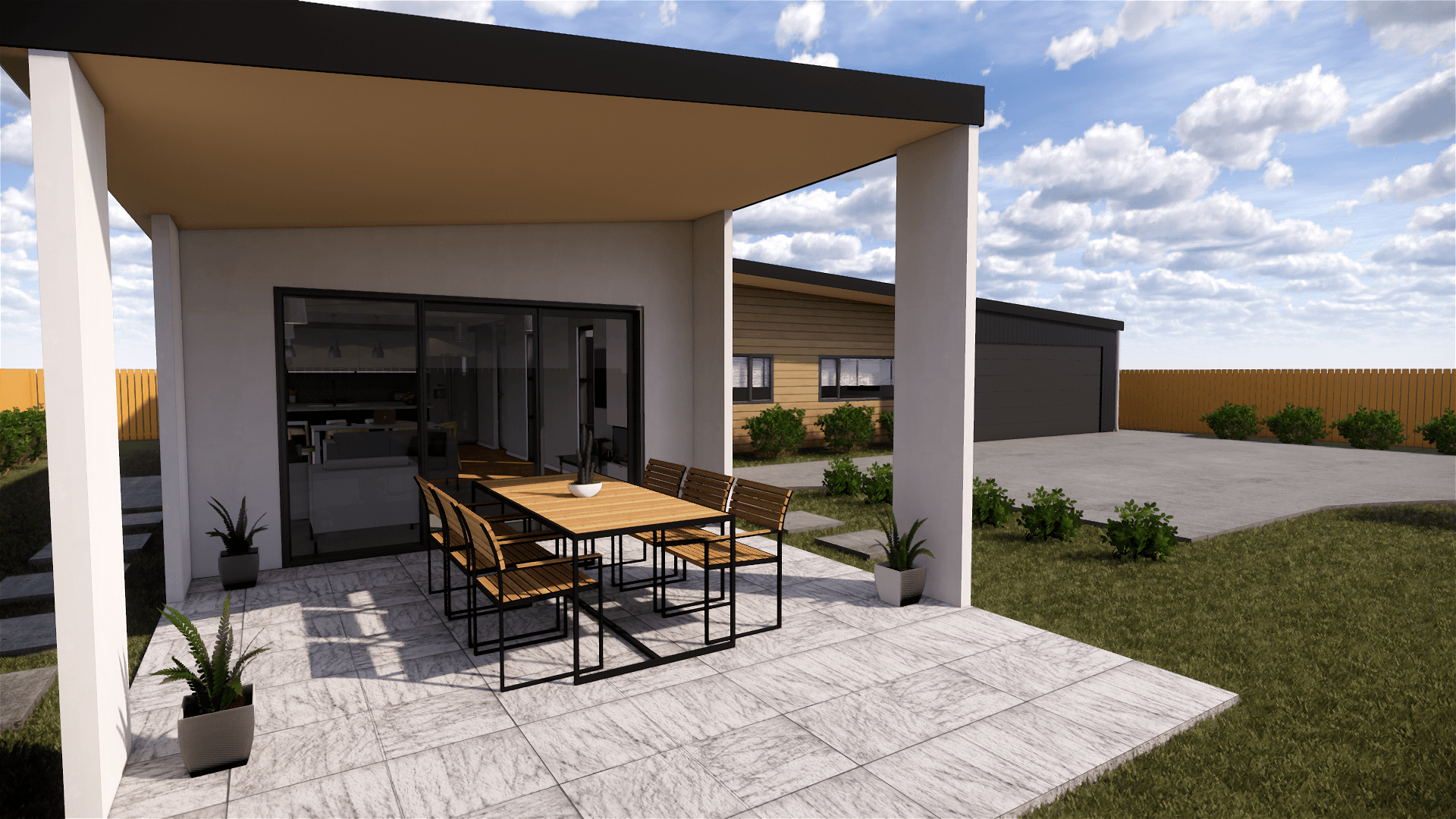 A patio with a table and chairs under a pergola in front of a house.
