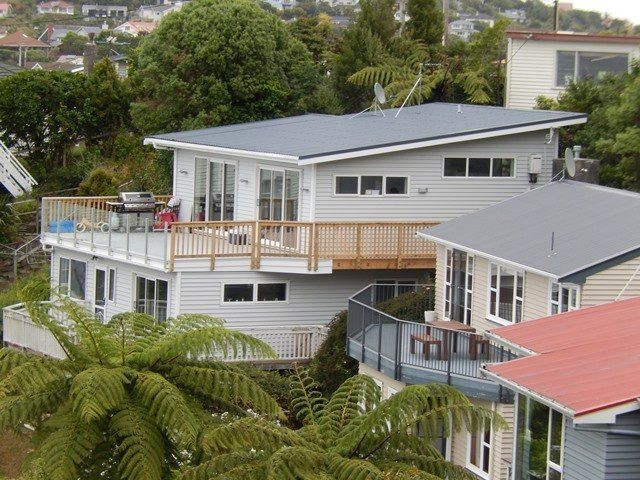 A house with a balcony on the top of it