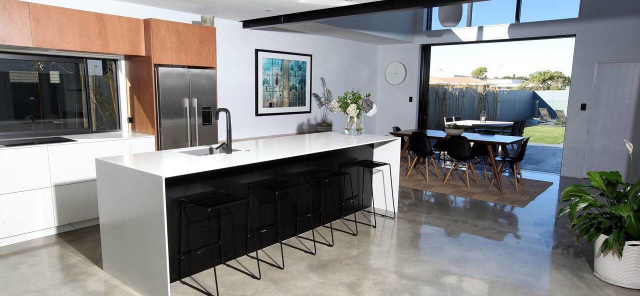 A kitchen with a large island in the middle of the room.