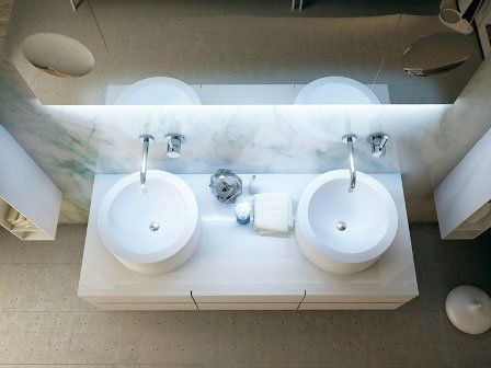 A bathroom with two sinks and a mirror
