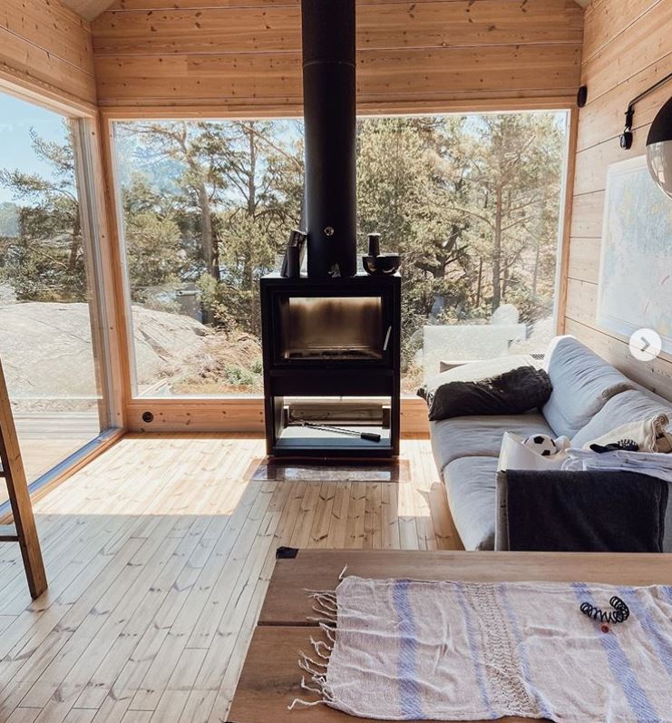 A living room with a fireplace and a couch